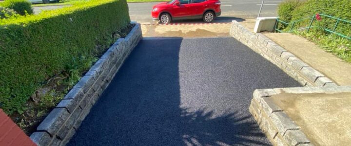 Asphalt driveway with Connemara walling completed 4