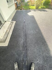 Asphalt driveway with granite cobble border and drainage5