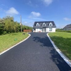 Tarmac driveway with silver granite borders